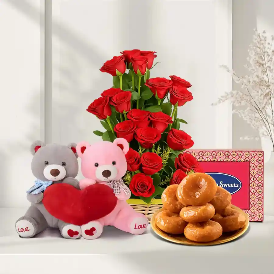 A charming gift basket featuring 15 red roses, Badusha sweets, and twin teddies, symbolizing love and affection.