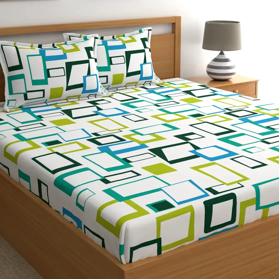 Stylish Geometric Print Double Bedsheet Set in blue with pillow covers, ideal for a cozy and modern bedroom aesthetic.