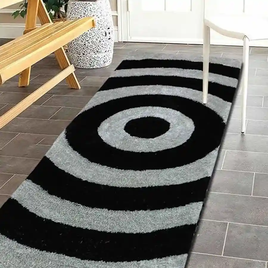 Black silver shaggy bedside rug made of microfibre polyester, featuring an anti-skid design and washable fabric. Perfect for modern bedrooms.