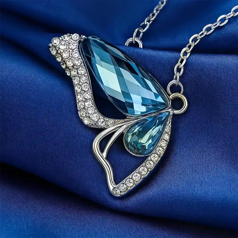 Elegant crystal butterfly pendant necklace with platinum plating.