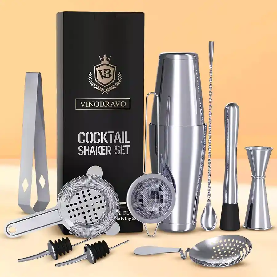 Stylish Cocktail Shaker Set featuring stainless steel tools for mixing drinks. Includes shaker, strainer, jigger, spoon, and muddler.