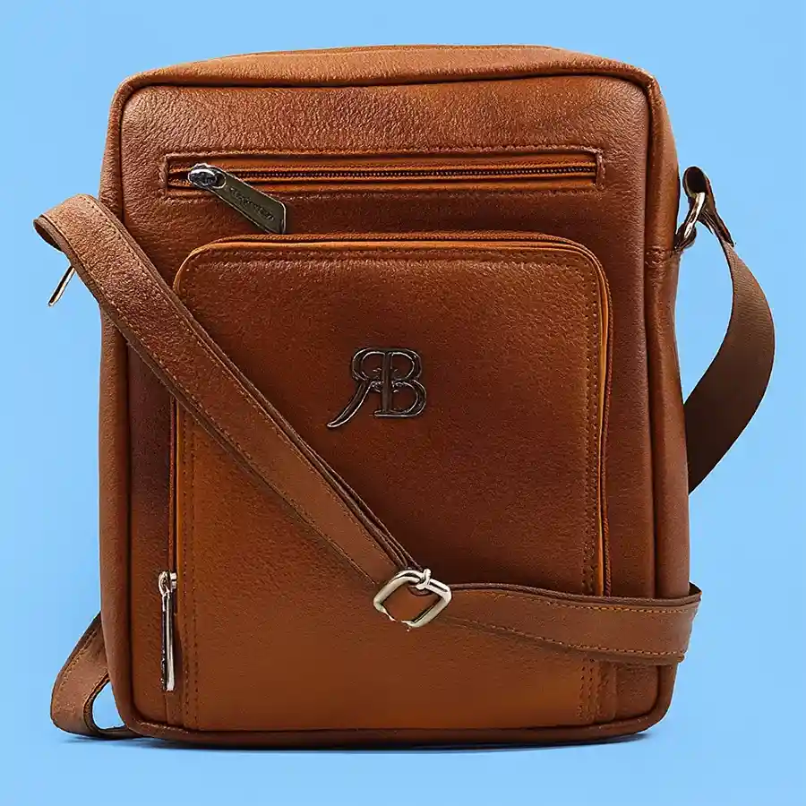 Stylish brown leather sling bag for men with zipped pockets.