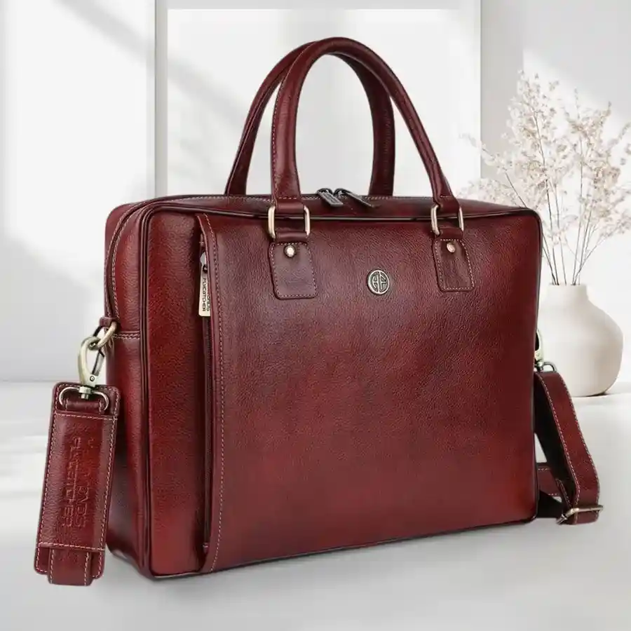 Premium stylish brown laptop bag for men, designed for 16" laptops and MacBooks, featuring a sleek shoulder strap for comfort and versatility.