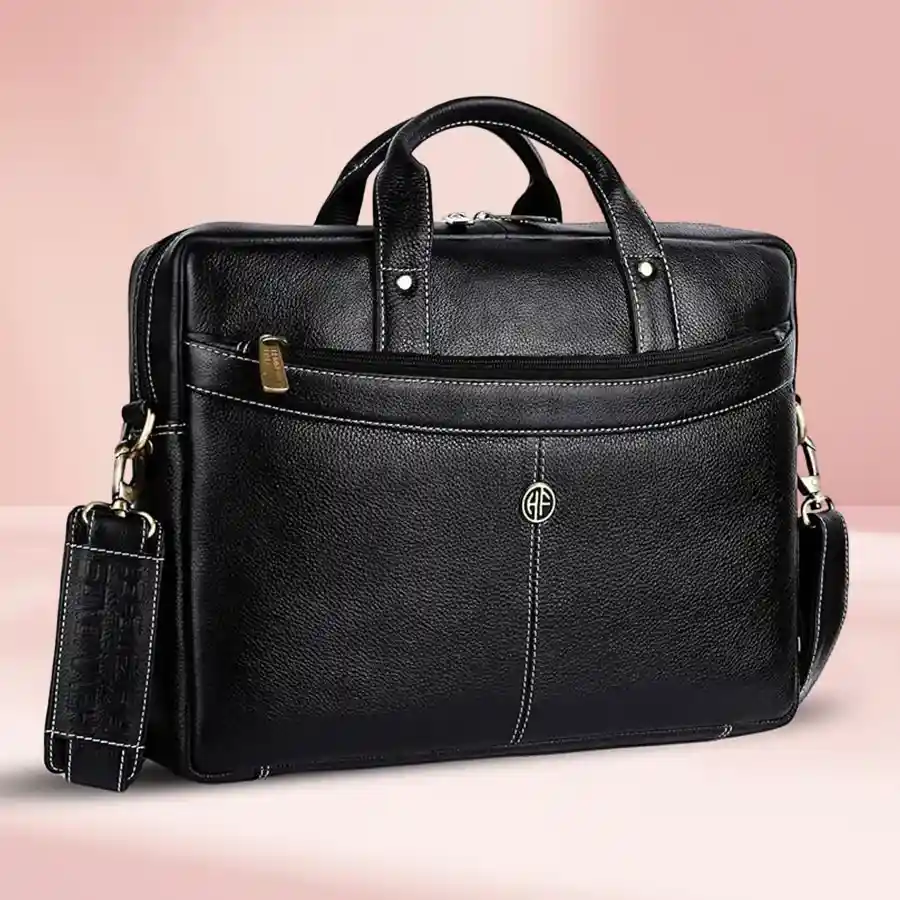 Stylish black leather laptop bag for men, designed to fit laptops up to 16 inches, featuring multiple compartments and an adjustable shoulder strap.