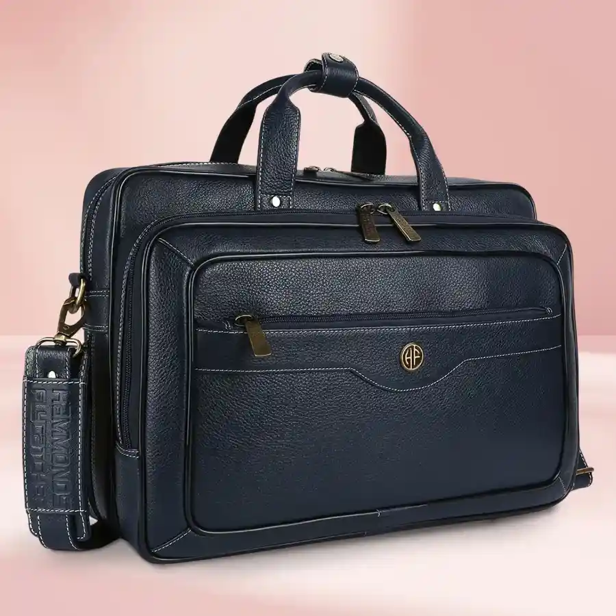 Stylish navy leather laptop bag for men, fitting up to 16-inch laptops, featuring an adjustable shoulder strap and durable construction.