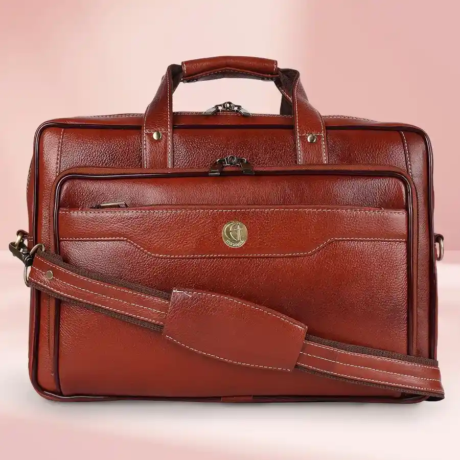 Elegant brown leather laptop bag for men, designed to fit up to 16-inch laptops with multiple compartments and an adjustable shoulder strap.