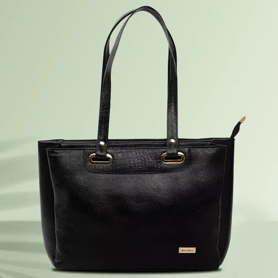 Elegant black shoulder bag with two partitions, crafted from faux leather, perfect for daily use.
