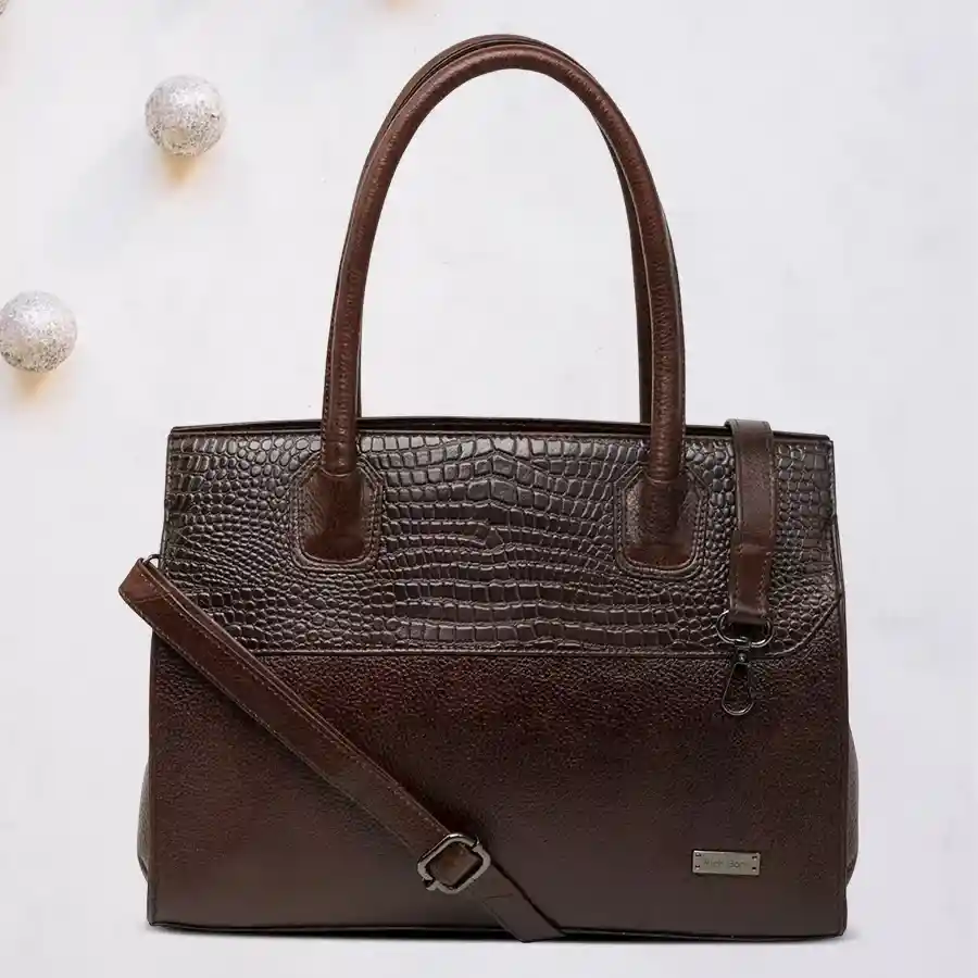 Elegant dark brown quilted shoulder bag with two spacious chambers.