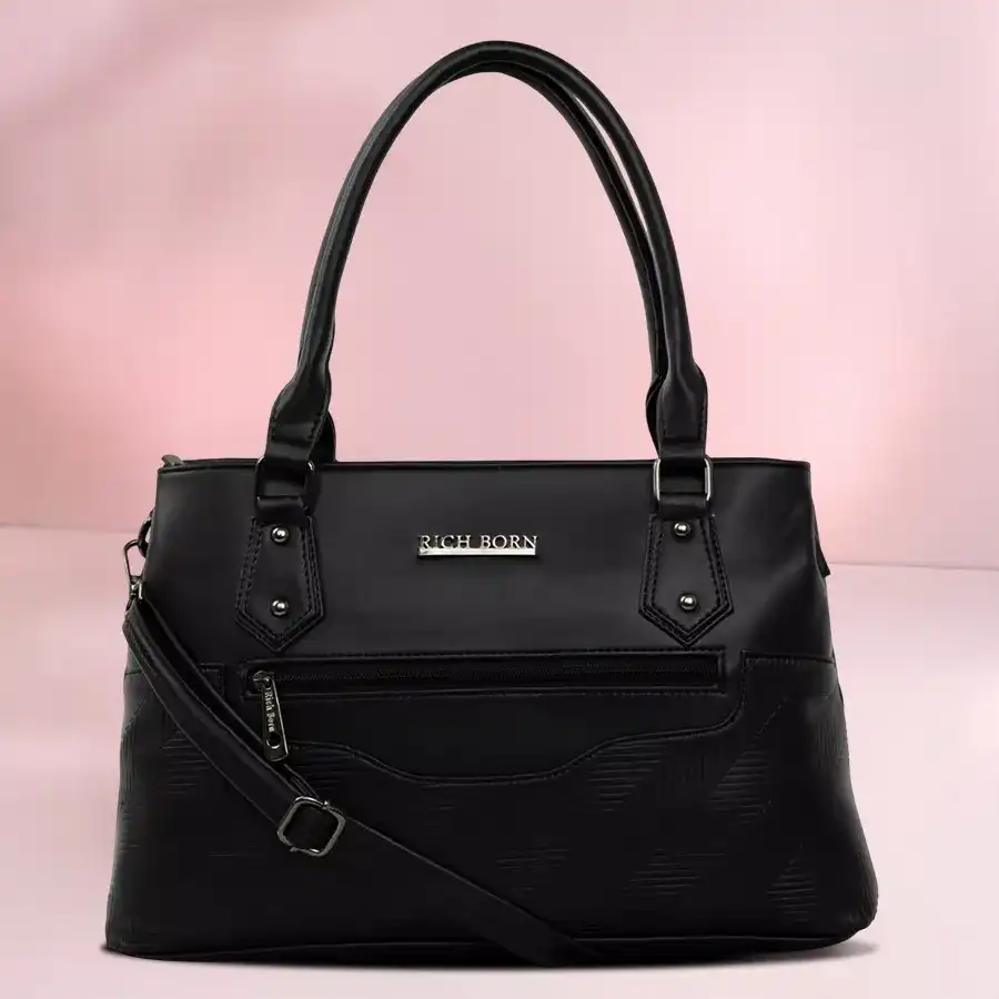 Unique black shoulder bag with balloon shape design and parallel strips for women.