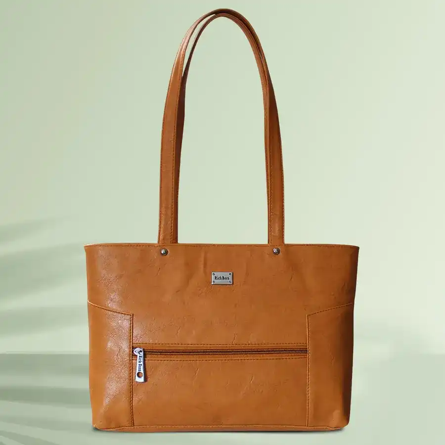 Chic Brown Faux Leather Vanity Bag with front stitches and two compartments, perfect for stylish organization.