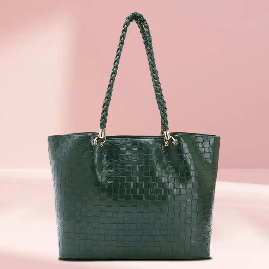 Chic green faux leather shoulder bag with two chambers and front zip, designed for stylish women.