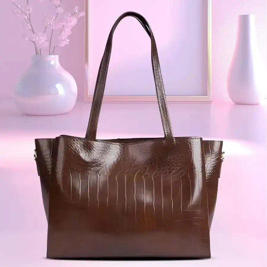 Chocolate brown crisscross designer shoulder bag for women with front zip and spacious chambers.