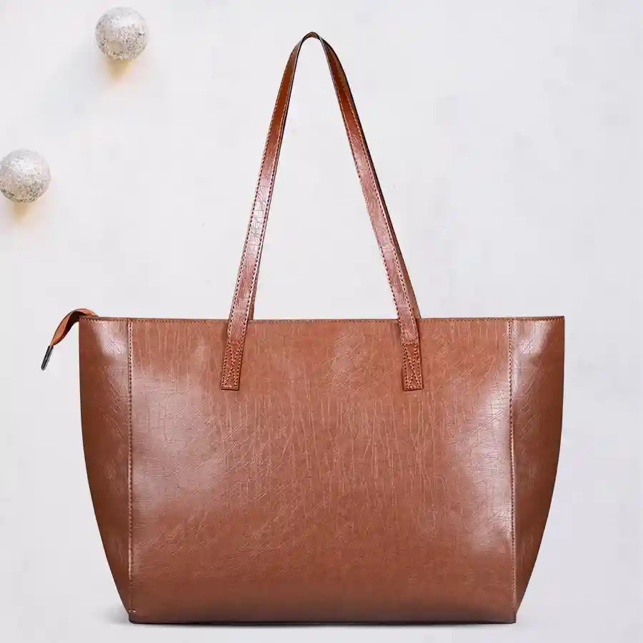 Stylish brown faux leather shoulder bag with dual chambers and front zip, perfect for everyday elegance.