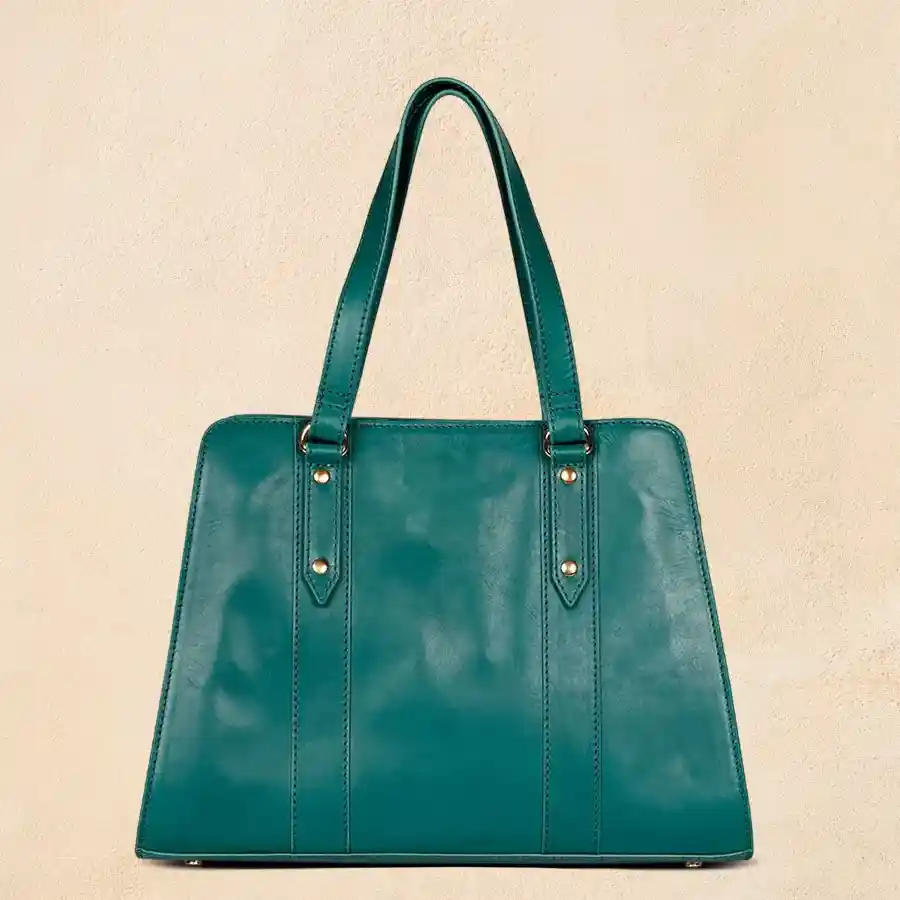 Chic green faux leather vanity bag with embossed design for women.