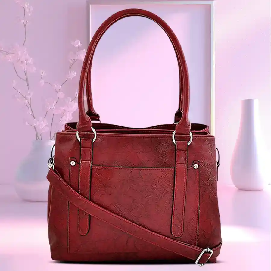 Chic Maroon Vanity Bag for women in faux leather with embossed pattern, featuring two compartments for easy organization.