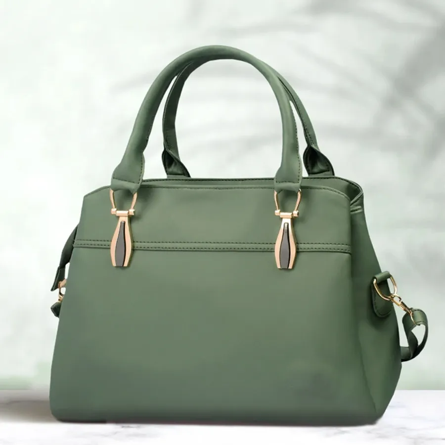 Stylish green square vanity bag with embossed pattern and two compartments for women.