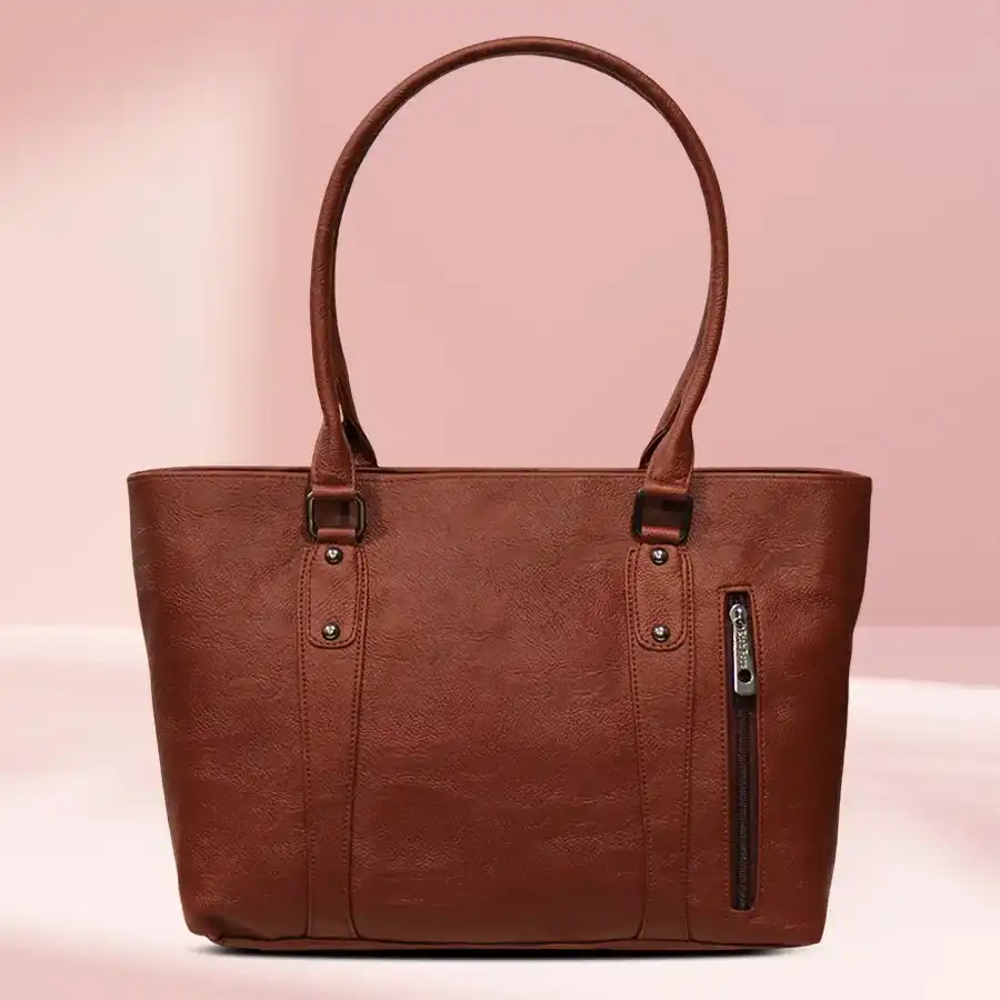 Stunning brown faux leather ladies handbag featuring gorgeous embroidery, perfect for elevating any outfit.