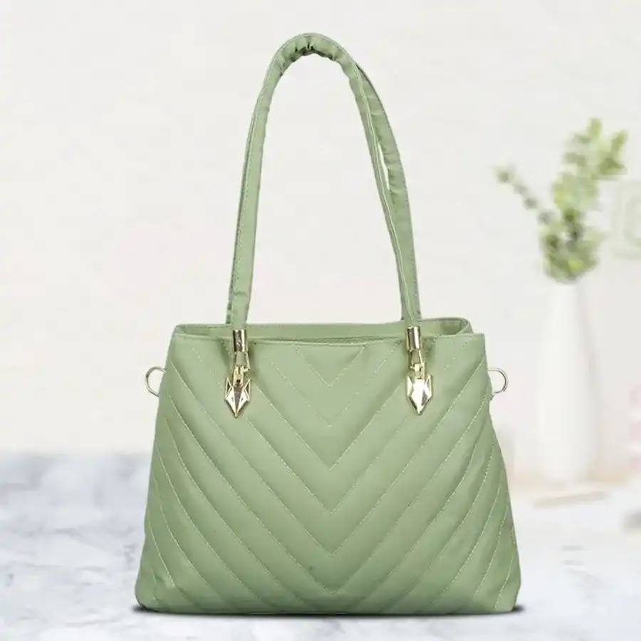 Light green ladies vanity bag featuring stunning embroidery, perfect for style and practicality.