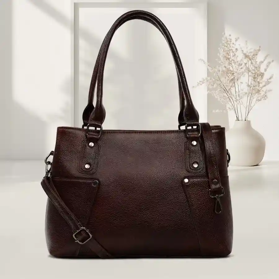 Vibrant green leather sling handbag featuring two spacious compartments, perfect for stylish organization and versatility.