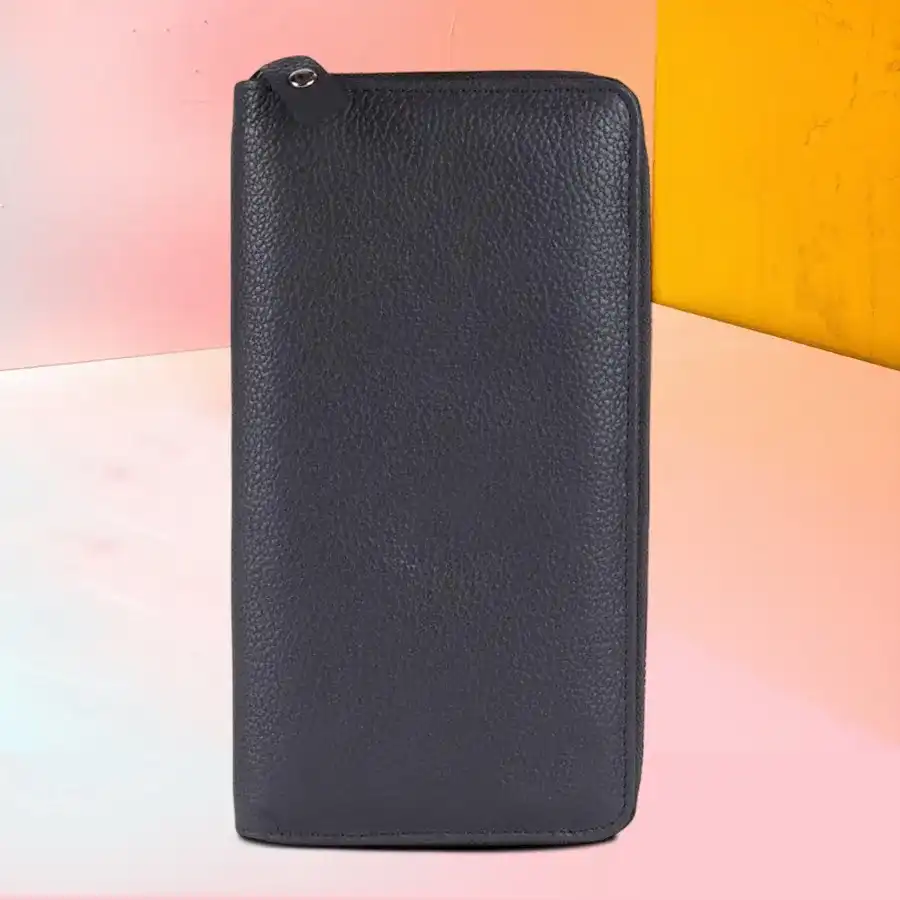 Sophisticated grey leather clutch for ladies, featuring minimalist design and snap closure, ideal for day and evening use.