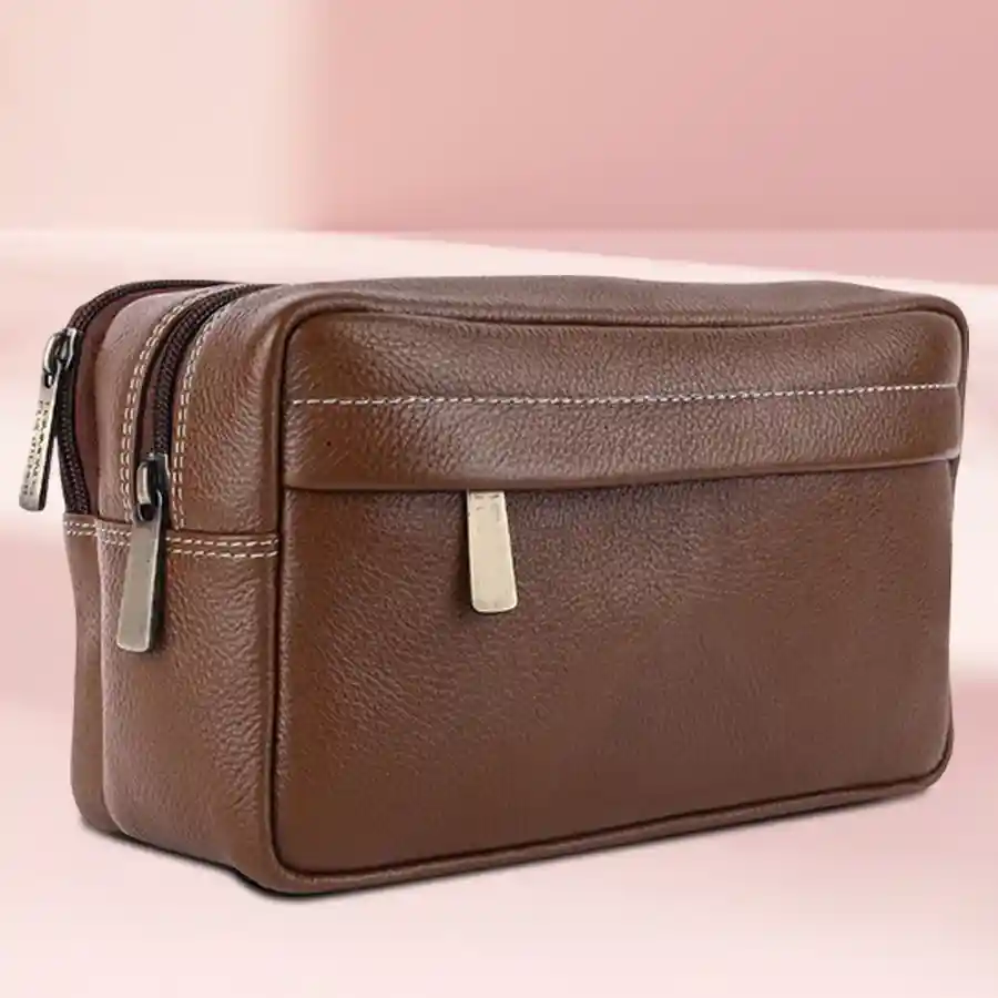 Stylish Leather Travel Kit in Brushwood color, designed for organization and elegance. Perfect for travel and grooming essentials.