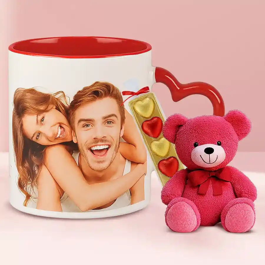 Beautiful gift combo featuring 10 mixed orchids in a glass vase and 250 grams of Motichur Laddu.