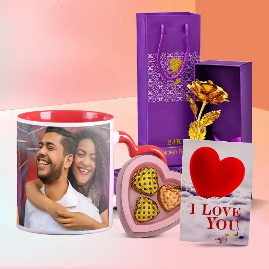 Alluring personalized photo mug with a heart-shaped handle, three heart-shaped chocolates, a golden rose, and an "I Love You" card.