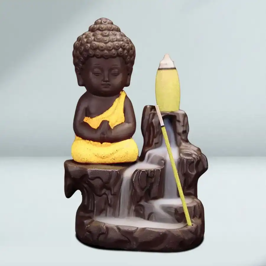Serene Buddha Polyresin Incense Smoke Burner Fountain in yellow, perfect for creating a tranquil atmosphere.