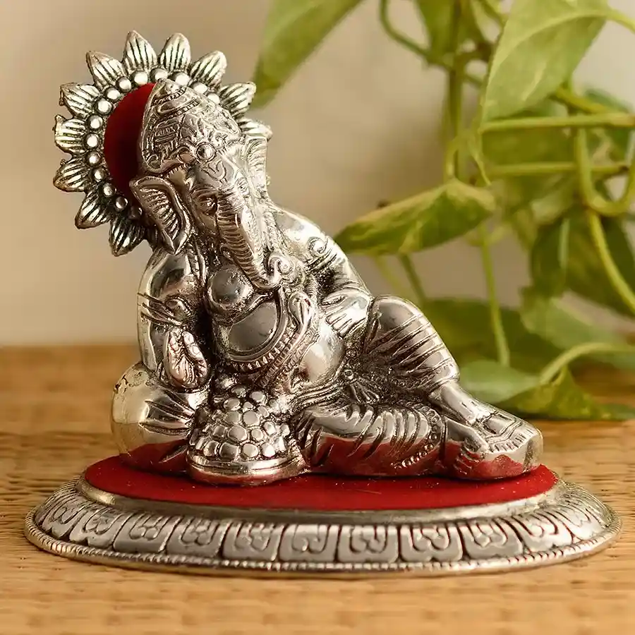 Exquisite Metal Ganpati Bappa Idol in silver and red.