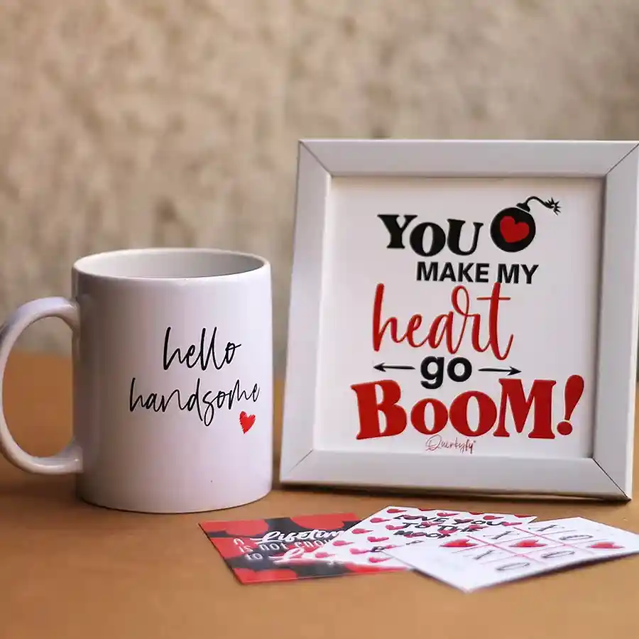 A charming Love's Embrace Gift Box containing a ceramic mug, a wall hanging frame, and three heartfelt love notes.