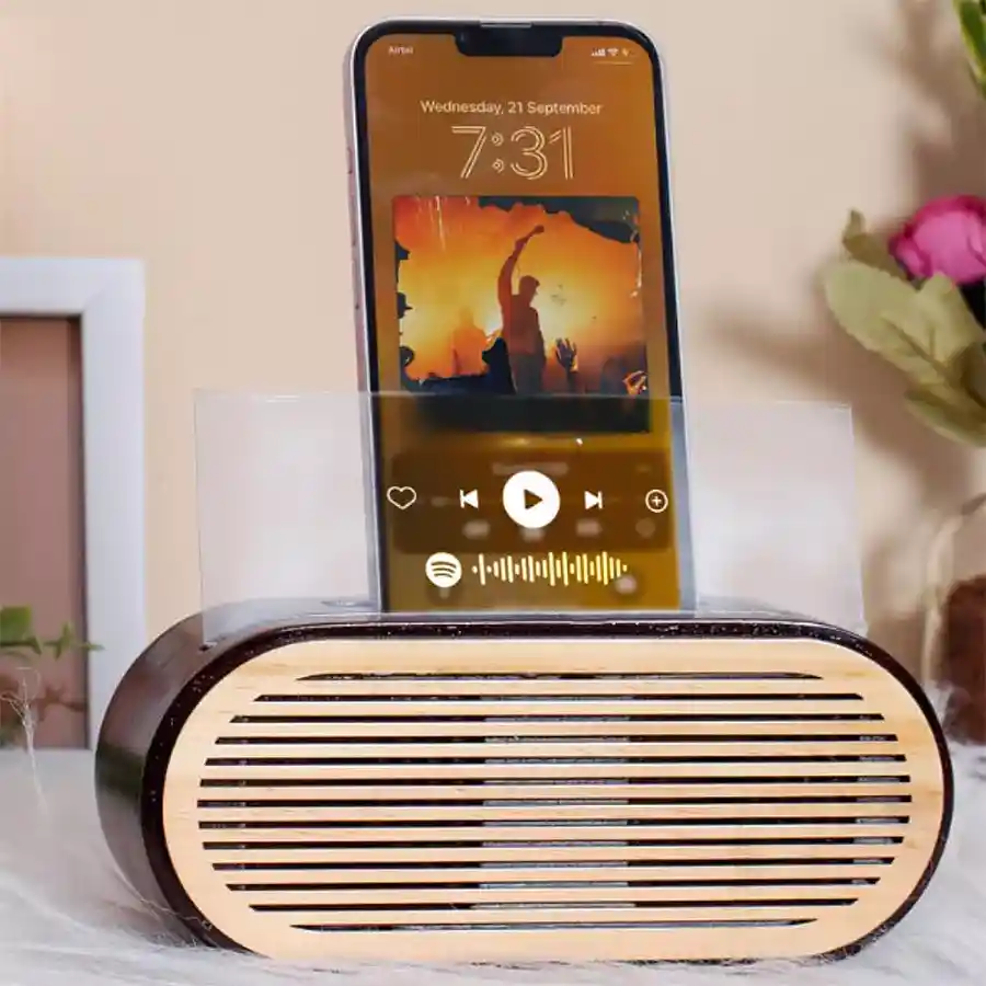 Wooden Mobile Sound Amplifier featuring a Spotify plaque, enhancing sound quality and style.
