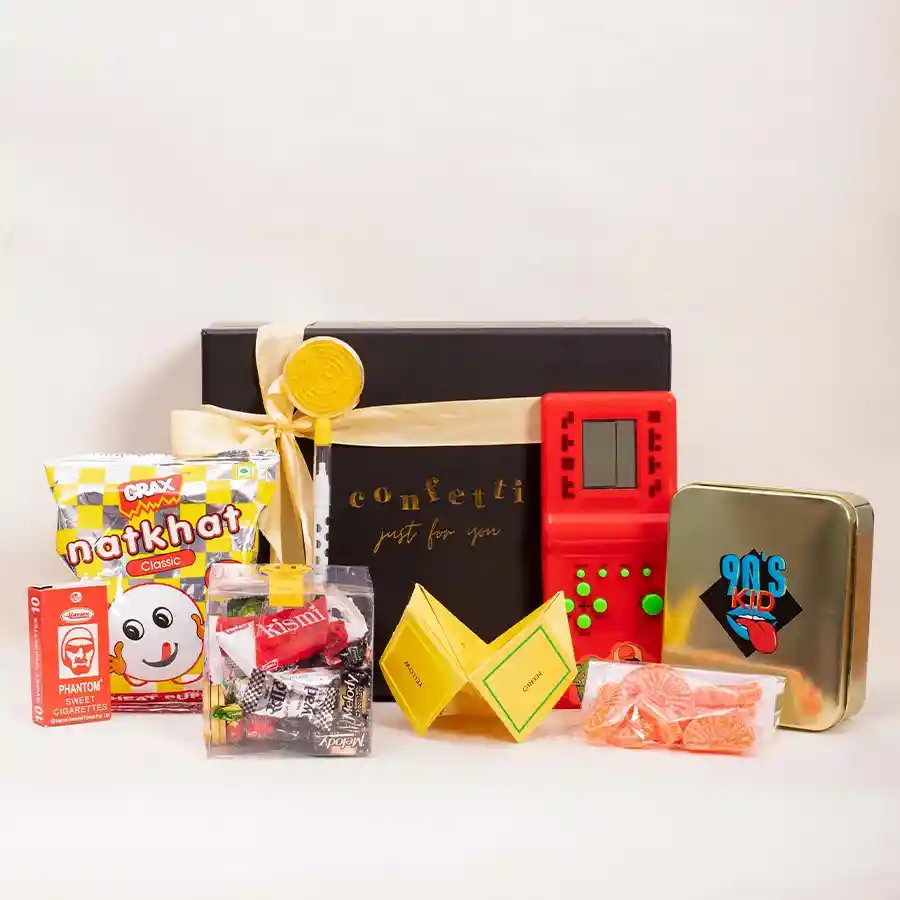 Cheerful Hamper for 90s Kids featuring nostalgic games, snacks, and a reusable black box.