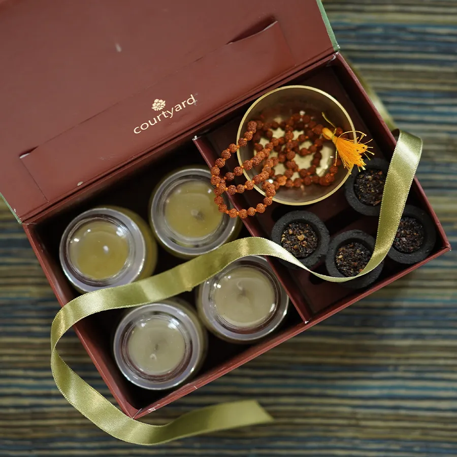 Serene Ekaki Meditation Essentials featuring candles, incense, and Rudraksha mala for a calming meditation experience.