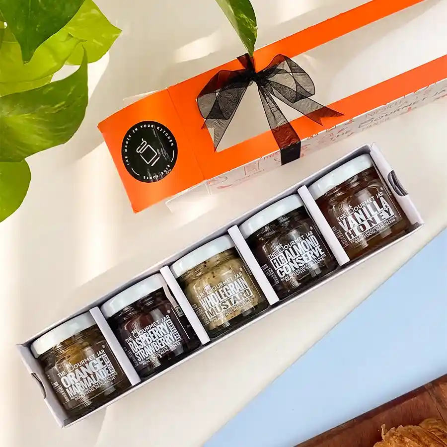 Gourmet Preserve and Honey Collection featuring a variety of sweet and savory spreads in mini jars.