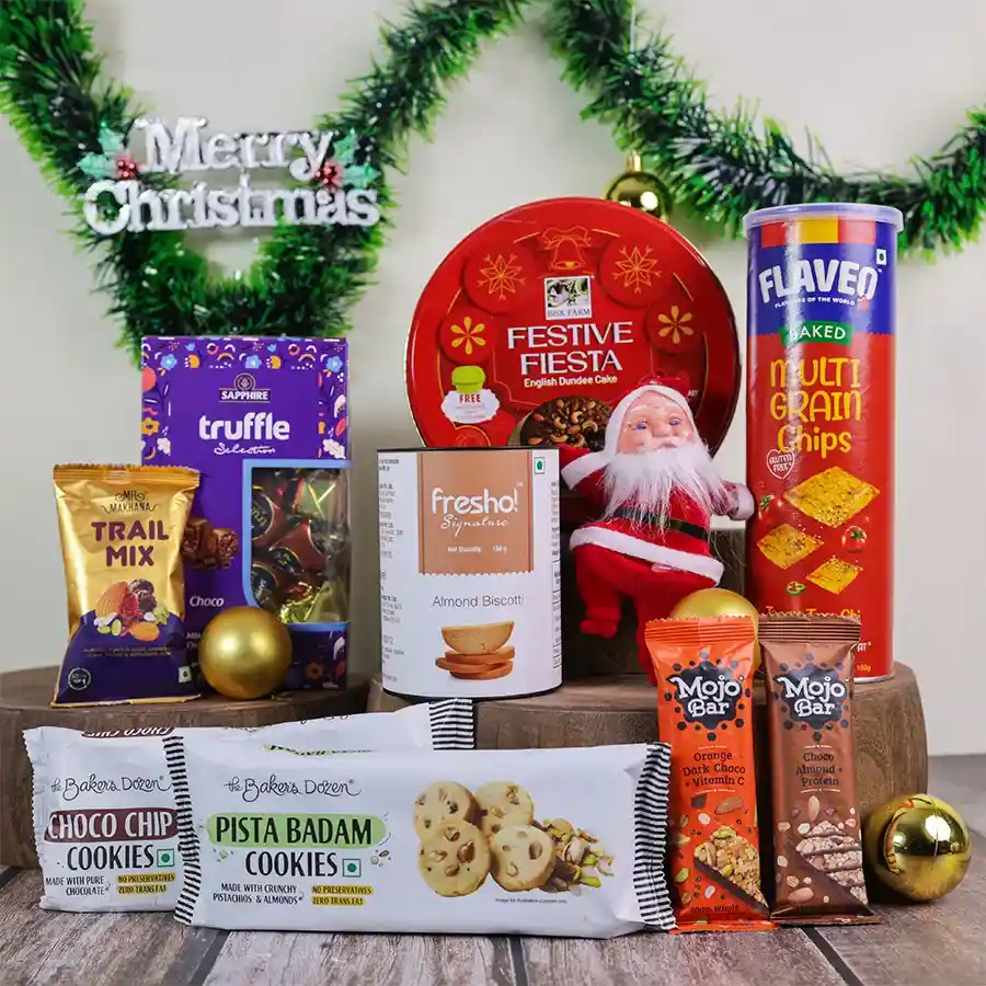 Festive Snack Celebration Basket with assorted gourmet treats and a Santa toy, perfect for holiday gifting.