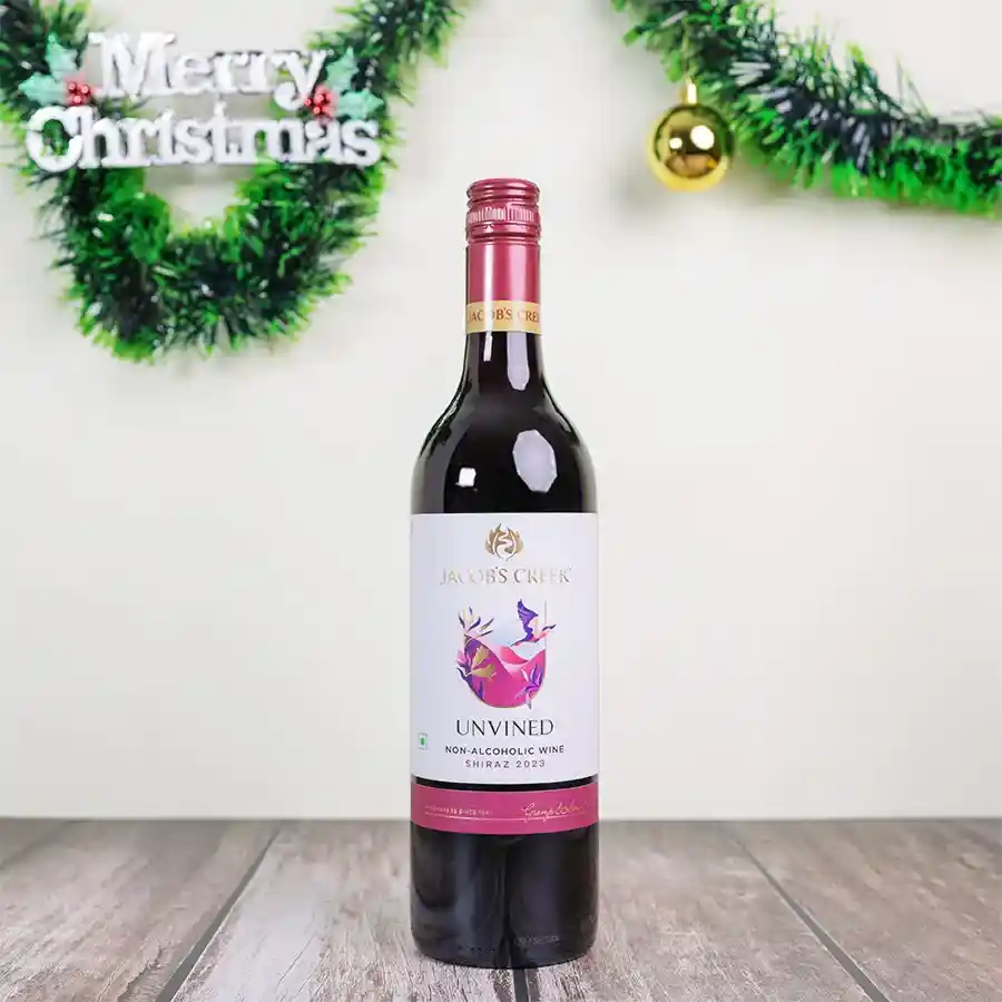 A festive Christmas gift hamper featuring a 750ml bottle of Jacob's Creek UNVINED Shiraz non-alcoholic red wine.