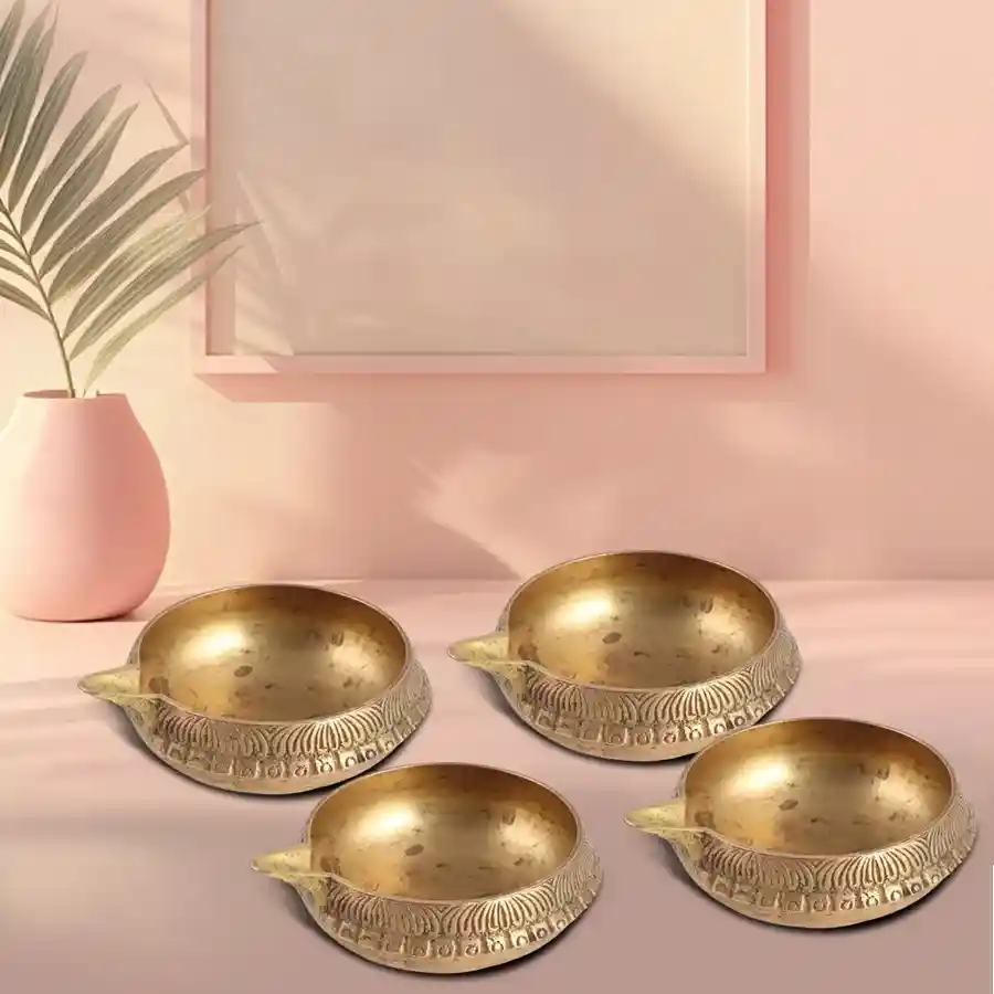 Golden Engraved Oil Lamp Gift Set featuring four brass lamps for Puja.