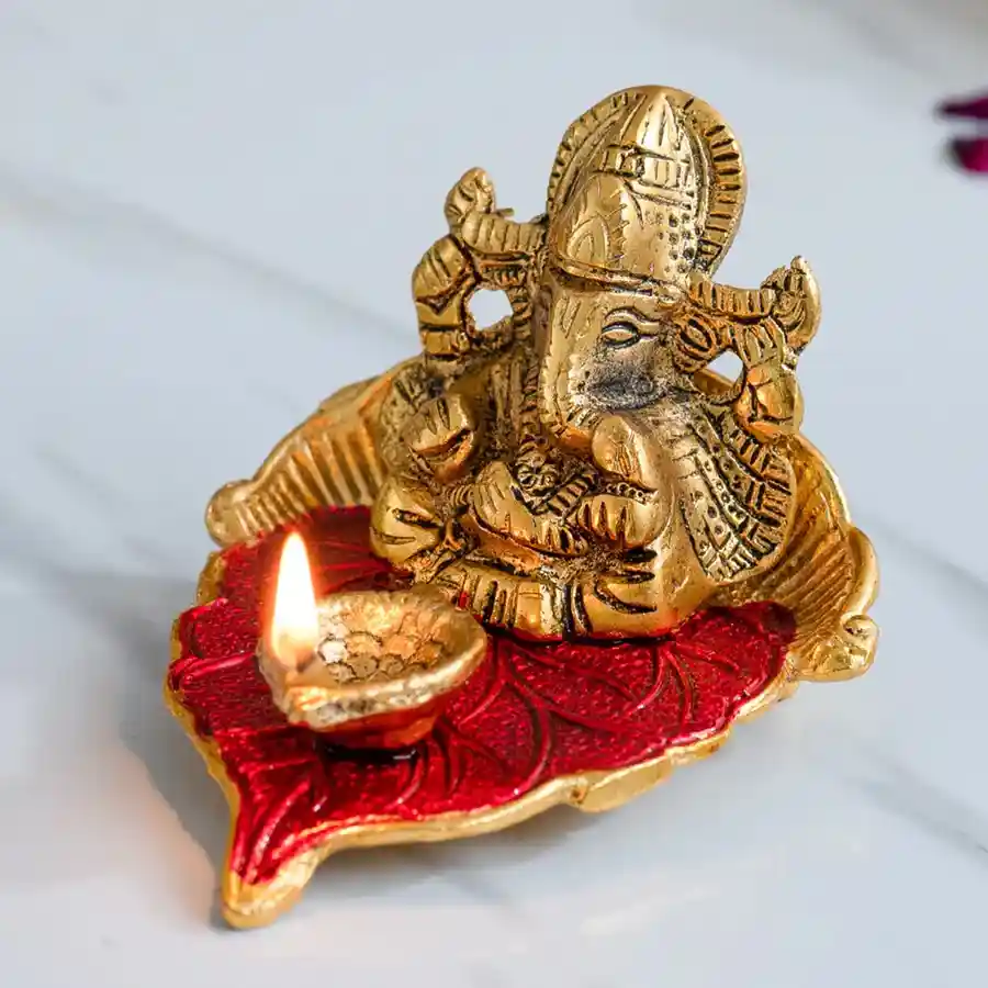 Ganesha on Leaf with Diya, an elegant aluminum metal decorative piece for Pooja and Diwali celebrations.