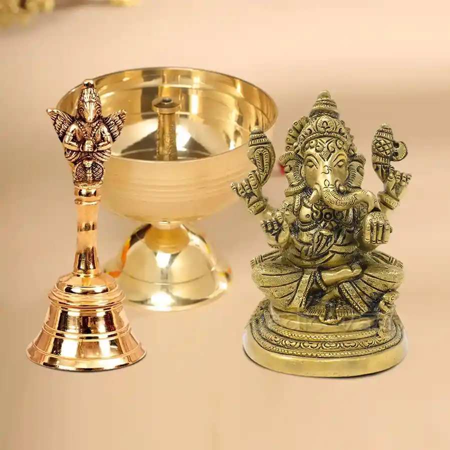 Divine Ganesh Diya and Ghanti Set featuring brass diya, metal Ganesh idol, and brass ghanti in gold.