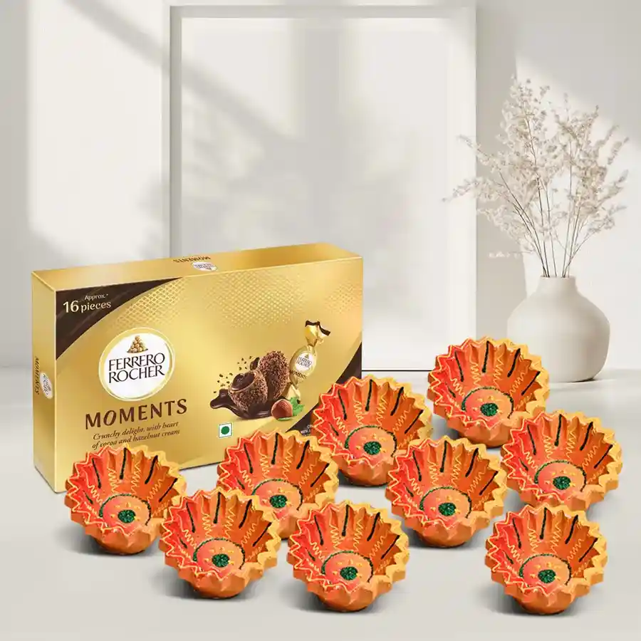 Delightful Diya Fusion Gift Set featuring 12 brass diyas and 12 Ferrero Rocher chocolates, perfect for festive gifting.