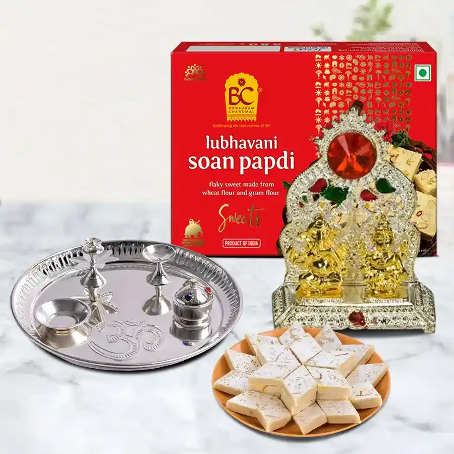 Sacred Pooja Celebration Gift Set featuring multicolor thali, sweets, and brass Ganesh Laxmi mandap.