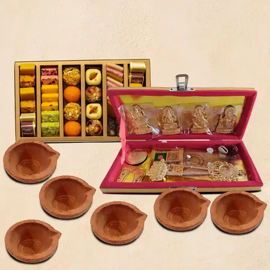 Prosperity and Blessings Yantra Set featuring brass idols, assorted sweets, and diyas for wealth and happiness.