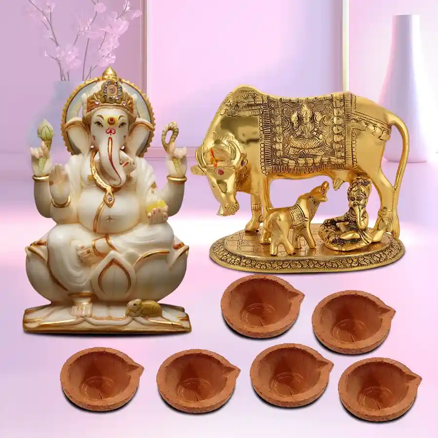 Pious Pooja Combo Gift featuring a brass Kamdhenu Cow with Calf, a Marble Ganesh Idol, and six mud diyas for festive rituals.