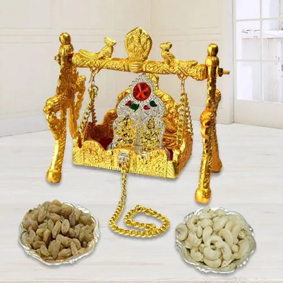 Divine Swing Gift Set Delight including Lakshmi Ganesh swing, antique mandap, and dry fruits in a silver bowl for pooja celebrations.