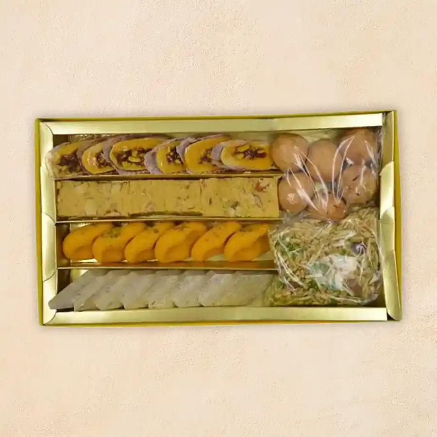Tranquil Treats Gourmet Selection featuring an assortment of traditional Indian sweets and snacks.