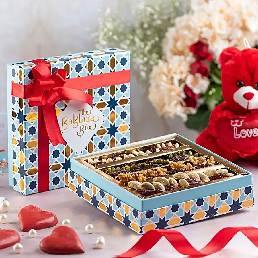 A beautiful blue box filled with gourmet stuffed dates, perfect for Valentine's Day gifting.