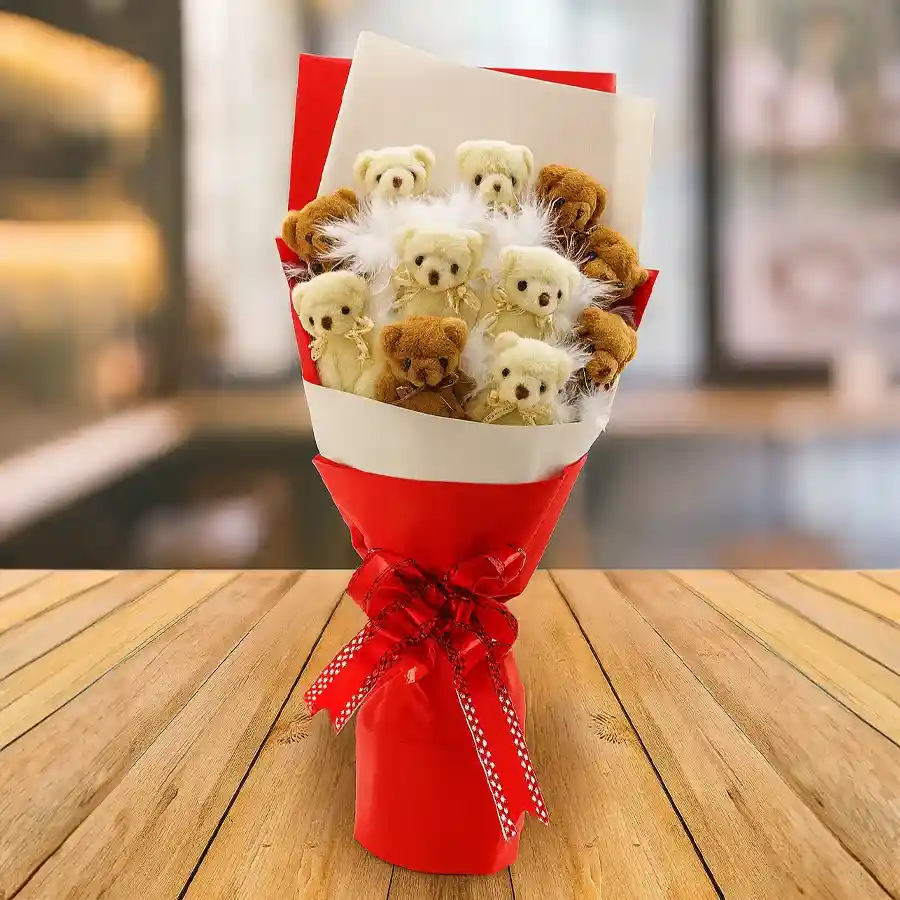 A delightful bouquet of ten small teddy bears wrapped in soft tissue, perfect for gifting on various occasions.