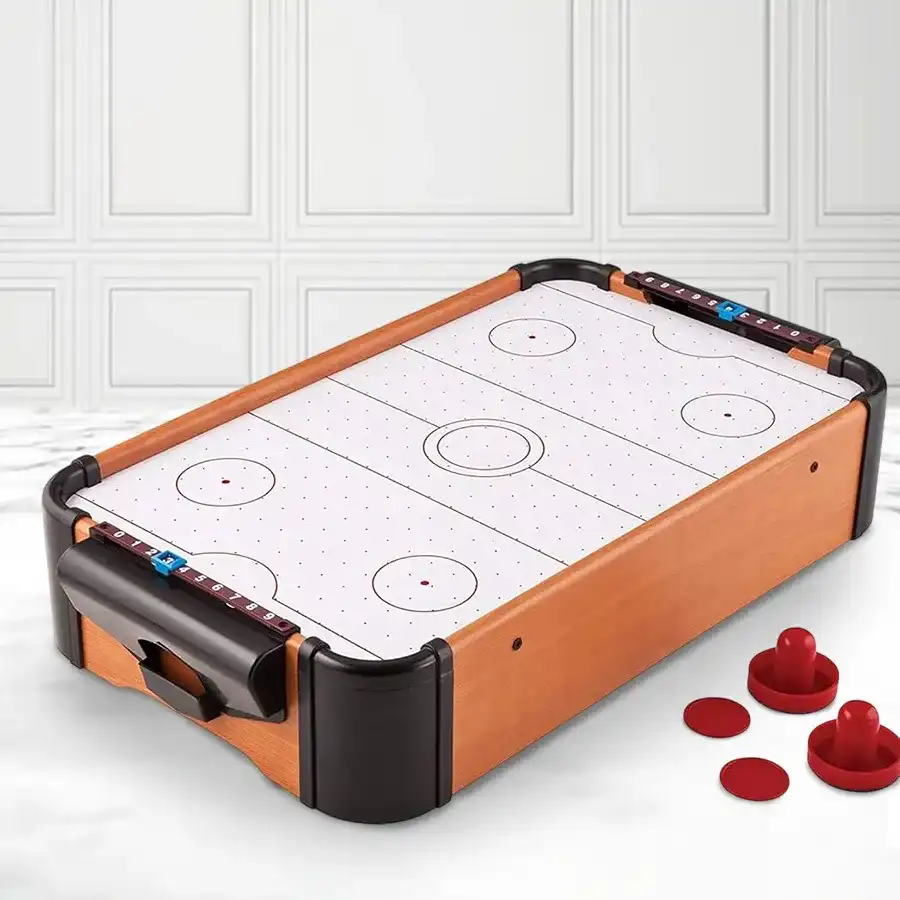 Indoor Action Sports Game Table featuring electric hockey and foosball for children aged 12 and up, complete with paddles and pucks.