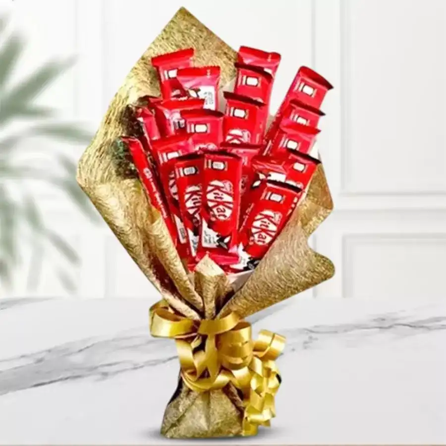 A stunning bouquet featuring 20 KitKat Chocolates elegantly wrapped in golden tissue, perfect for gifting.