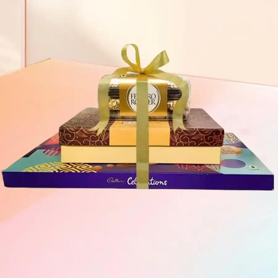 Indulgent Choco Nutty Delight Tower featuring Ferrero Rocher, dry fruits, and Cadbury Celebration box.